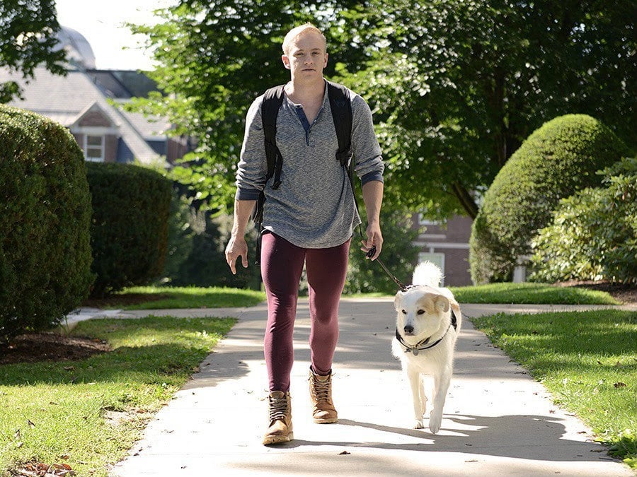 Landon and their service dog, Malibu